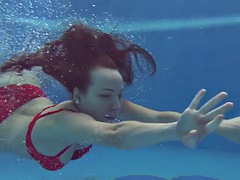 Big tits brunette babe Mia Ferrari swimming in the pool