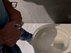 Pissing in a chastity cage