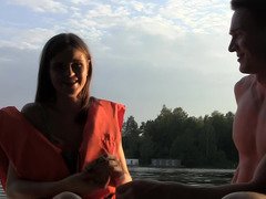 Delicious temptress is giving a blow job on the boat to a man