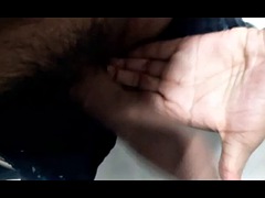 A young guy with a big dick masturbates in the office