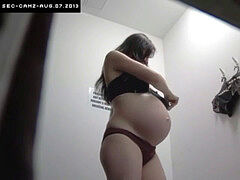sexy pregnant female in Changing Room