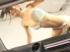 Japanese girl pressing boobs against windshield