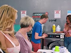 ADULT TIME - Clueless teen stripped naked and fucked a group of naughty MILFs in the laundry room!