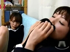 2 Asian Schoolgirls Sucking Each Other Toes On The Couch In The Sitting Roo