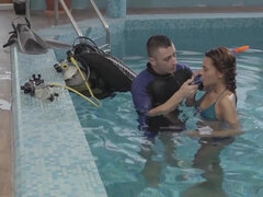 Alexis Brill and diving instructor are making out by the pool