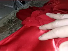 Crossdressing in red satin long dress