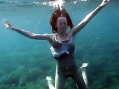 Swimming gracefully nude underwater