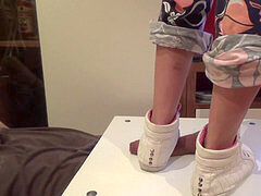 female in sneakers stomp on cock and balls. Ends bootjob and jizz shot