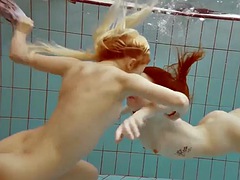 Two hot girls enjoy the pool naked