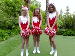 Three spunky cheerleaders servicing rock hard cock outdoors