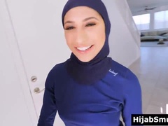 Personal trainer stretching muslim girls glutes