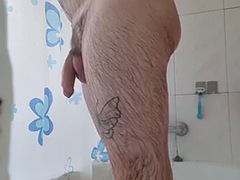Hairy man showers and masturbates