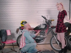 Blonde girl Misha Cross is being fucked by a horny biker in the garage