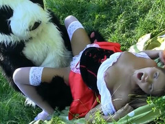 Fella in a panda suit is penetrating a breasty woman in the field