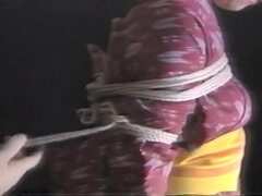 Older babe in a sexy kimono hogtied and stimulated