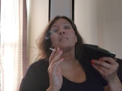 Big beautiful woman (BBW) uses leather cigarette case to give smoking fetish handjob