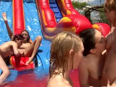 Kittens are fucking each and every other at a water slide in a hot orgy.