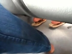 Real hidden footsie with dame in bus she enjoys