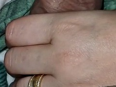 Stepmom handjob under the blanket makes her stepsons cock hard as a rock