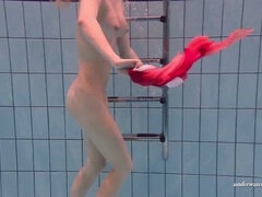 European beauty Duna Bultihalo showcases her tight figure in underwater clothed photoshoot
