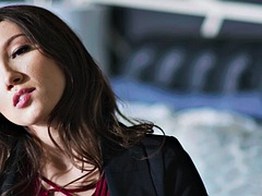 Two workers handle Maya Woulfe