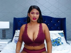 Sexy Latina shows sizeable brown breasts and areolas on cam