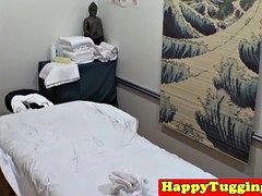 Asian masseuse jerking cock before cumshot