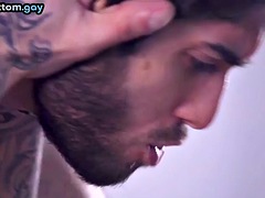 Gay tattooed muscleman getting his anal hole fucked by a hairy hunk