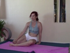 Redhead MILF's yoga wheel and evening stretch lead to steamy behind-the-scenes and nude content