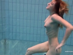 European beauty Duna Bultihalo showcases her tight figure in underwater clothed photoshoot