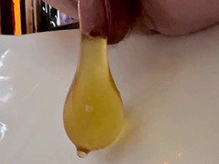 Hot yellow morning piss in a condom