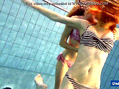 insane girls disrobe eachother in the pool