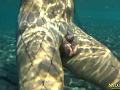 Fishnet stocking in public sea and beach